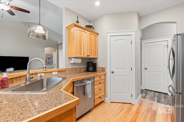 551 N Hannah Pl, Star, ID 83669 - kitchen with stainless steel appliances, tile countertops, light brown cabinetry, ceiling fan, and light wood finished floors