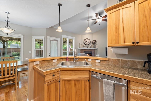 551 N Hannah Pl, Star, ID 83669 - kitchen featuring stainless steel dishwasher, tile countertops, a peninsula, and light wood-type flooring