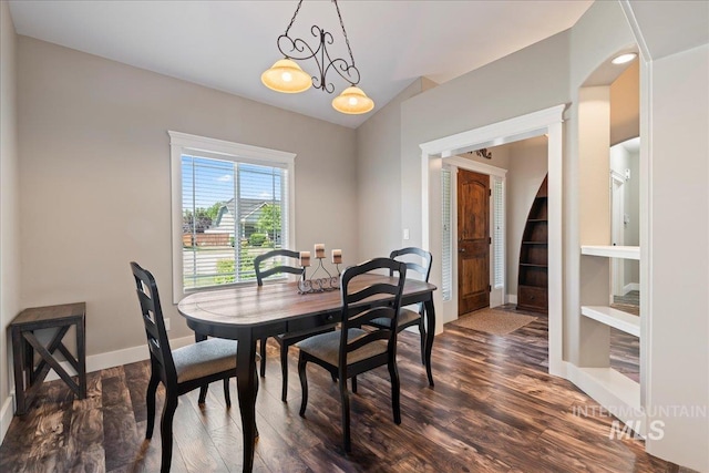 551 N Hannah Pl, Star, ID 83669 - dining area with dark wood finished floors, lofted ceiling, and arched walkways