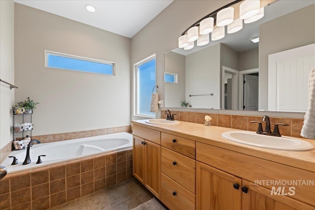 551 N Hannah Pl, Star, ID 83669 - full bathroom featuring a bath, double vanity, and tile patterned floors