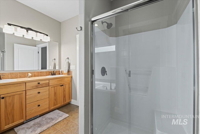 551 N Hannah Pl, Star, ID 83669 - bathroom with a shower stall, double vanity, and tile patterned flooring