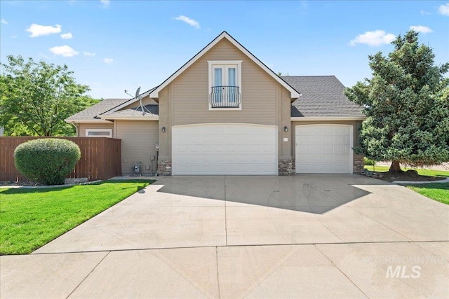 551 N Hannah Pl, Star, ID 83669 - traditional home with stone siding, concrete driveway, a garage, and a shingled roof