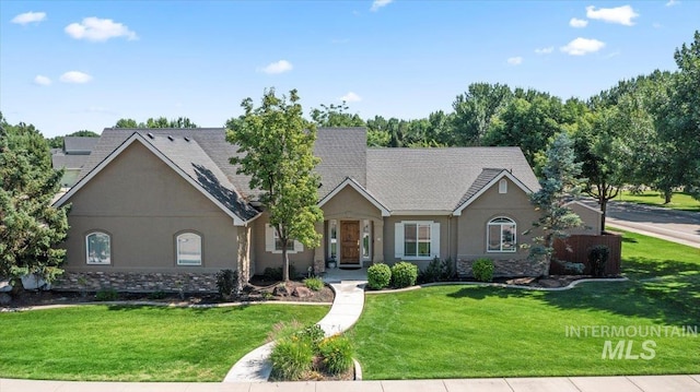 551 N Hannah Pl, Star, ID 83669 - ranch-style house with stucco siding, a front yard, stone siding, and roof with shingles