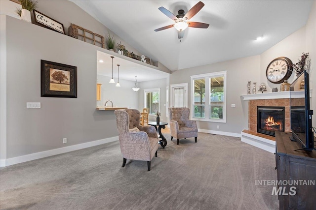 551 N Hannah Pl, Star, ID 83669 - living area featuring vaulted ceiling, a tiled fireplace, carpet, and a ceiling fan