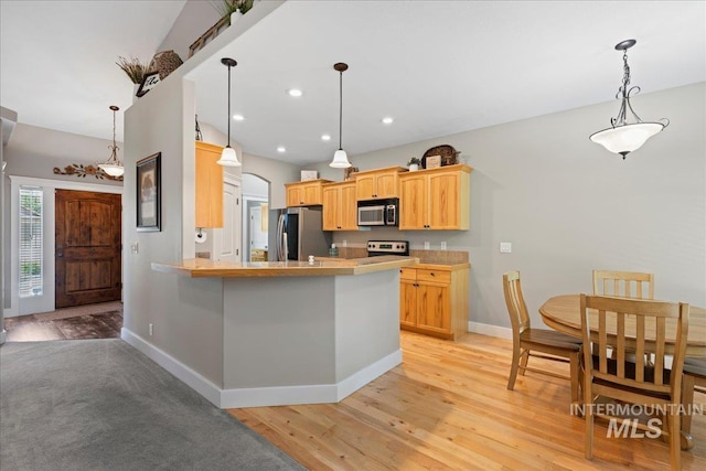 551 N Hannah Pl, Star, ID 83669 - kitchen featuring freestanding refrigerator, electric range oven, light wood-style flooring, recessed lighting, and a peninsula