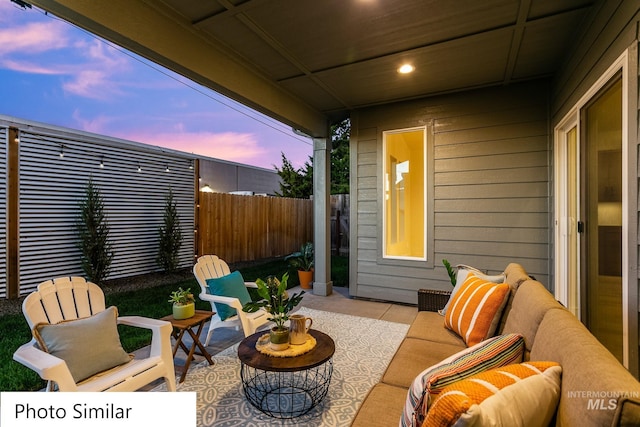 view of patio with fence and an outdoor hangout area