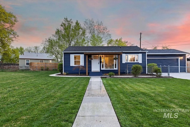 5805 W Robertson Dr, Boise, ID 83709 - view of front of house featuring a garage, a front lawn, and fence