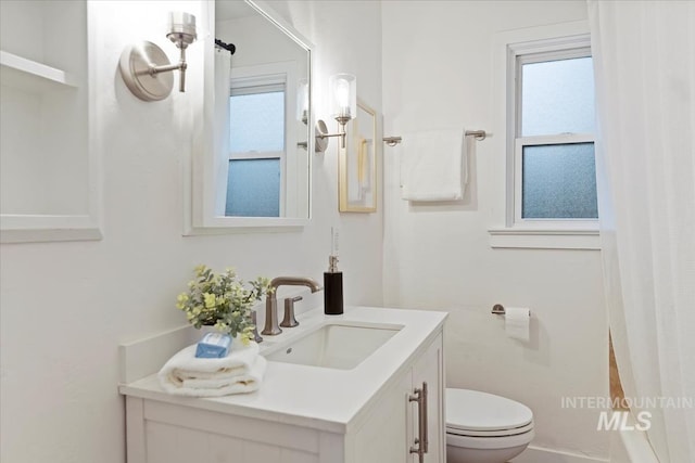 5805 W Robertson Dr, Boise, ID 83709 - bathroom featuring toilet, vanity, and a shower with shower curtain