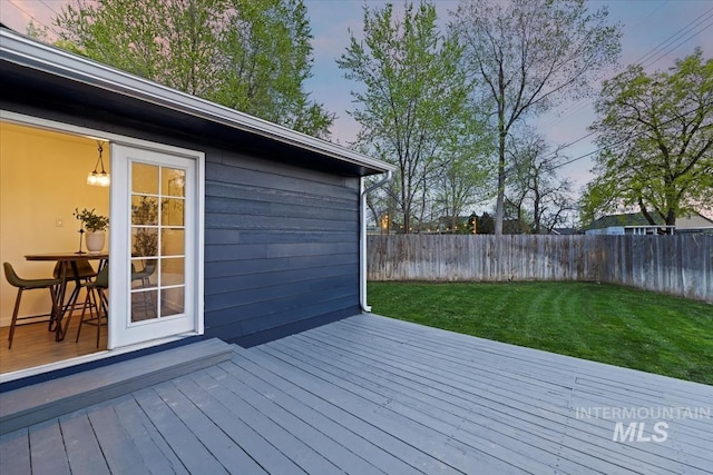 5805 W Robertson Dr, Boise, ID 83709 - wooden terrace featuring a lawn and a fenced backyard