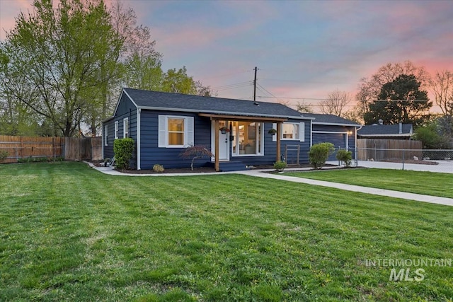 5805 W Robertson Dr, Boise, ID 83709 - view of front facade with a lawn and fence