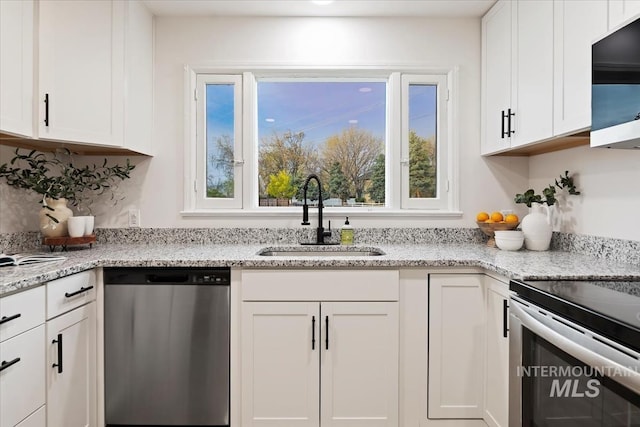5805 W Robertson Dr, Boise, ID 83709 - kitchen featuring plenty of natural light, appliances with stainless steel finishes, white cabinetry, and a sink