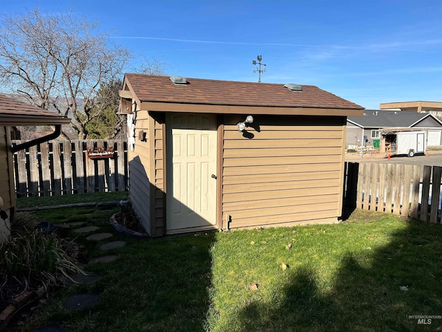 view of shed / structure featuring a yard