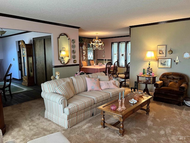 carpeted living room featuring ornamental molding, a textured ceiling, and an inviting chandelier