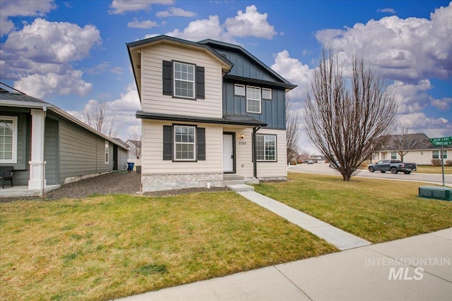 front facade featuring a front yard