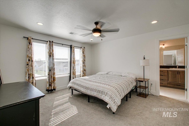 bedroom with recessed lighting, baseboards, visible vents, and light colored carpet