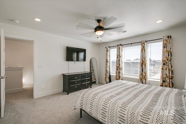 bedroom with recessed lighting, visible vents, baseboards, light colored carpet, and ceiling fan
