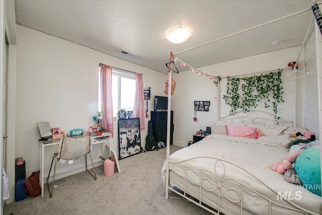 carpeted bedroom with baseboards and visible vents