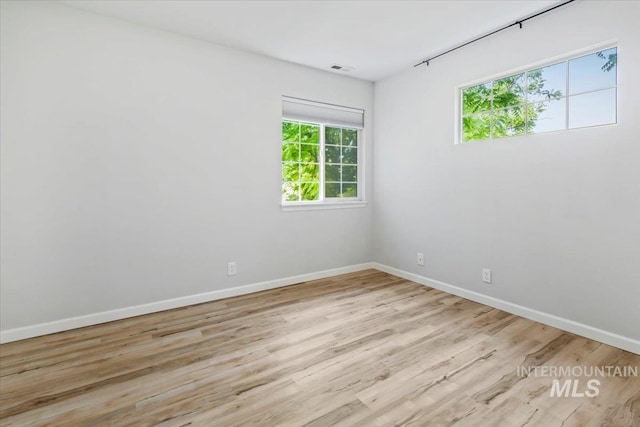 2285 S Challenger Unit 201, Boise, ID 83705 - unfurnished room with baseboards and wood finished floors