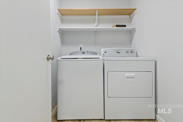 2285 S Challenger Unit 201, Boise, ID 83705 - laundry room featuring washing machine and clothes dryer