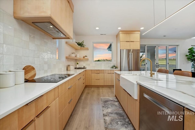 12975 Shasta Daisy Way, Nampa, ID 83686 - kitchen featuring appliances with stainless steel finishes, a sink, modern cabinets, light brown cabinetry, and light wood-style flooring