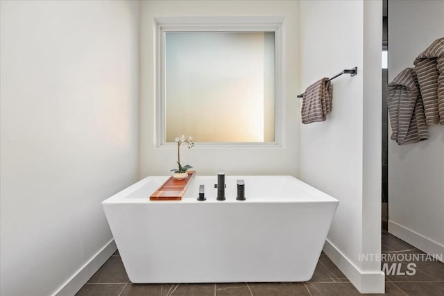 12975 Shasta Daisy Way, Nampa, ID 83686 - full bath with baseboards, a soaking tub, and tile patterned floors