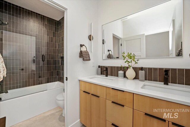 12975 Shasta Daisy Way, Nampa, ID 83686 - bathroom with toilet, double vanity, shower / tub combination, and tile patterned floors