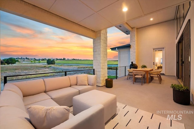 12975 Shasta Daisy Way, Nampa, ID 83686 - patio terrace at dusk featuring an outdoor hangout area and a water view