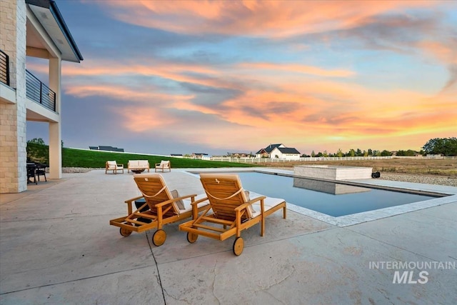 12975 Shasta Daisy Way, Nampa, ID 83686 - pool at dusk with a patio