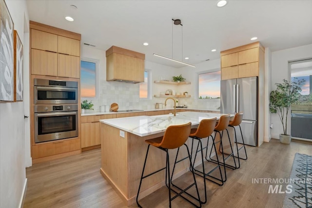 12975 Shasta Daisy Way, Nampa, ID 83686 - kitchen featuring appliances with stainless steel finishes, light brown cabinetry, modern cabinets, and recessed lighting