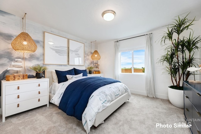 bedroom featuring light colored carpet