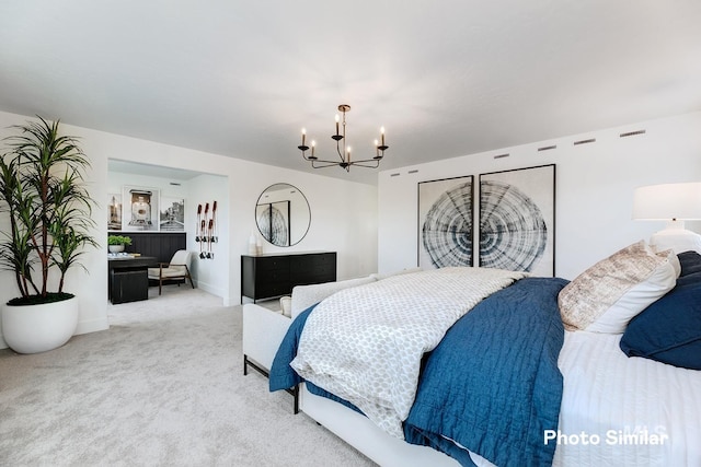 carpeted bedroom with a notable chandelier