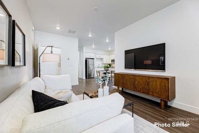 living room featuring dark hardwood / wood-style flooring