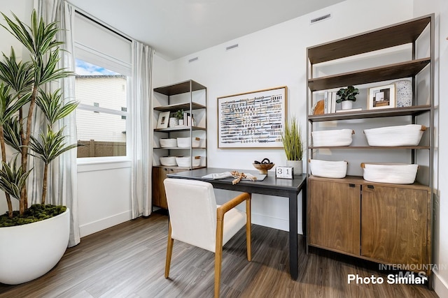 home office with dark wood-type flooring