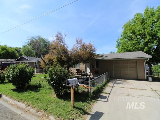210 W 2nd St, Middleton, ID 83644 - view of front of home featuring an attached garage and driveway