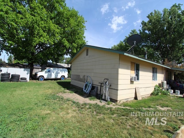 210 W 2nd St, Middleton, ID 83644 - view of home's exterior with a lawn and cooling unit