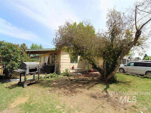 210 W 2nd St, Middleton, ID 83644 - rear view of house with a yard