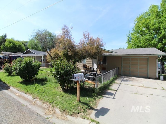 210 W 2nd St, Middleton, ID 83644 - view of front of property with an attached garage and driveway