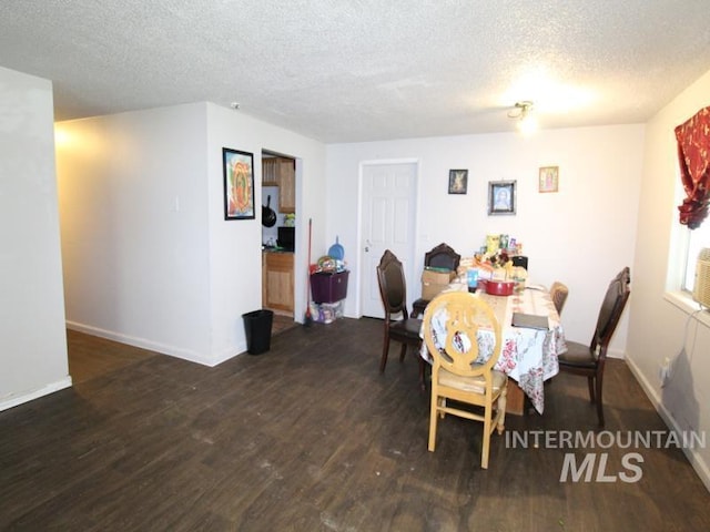 210 W 2nd St, Middleton, ID 83644 - dining room featuring wood finished floors, a textured ceiling, and baseboards