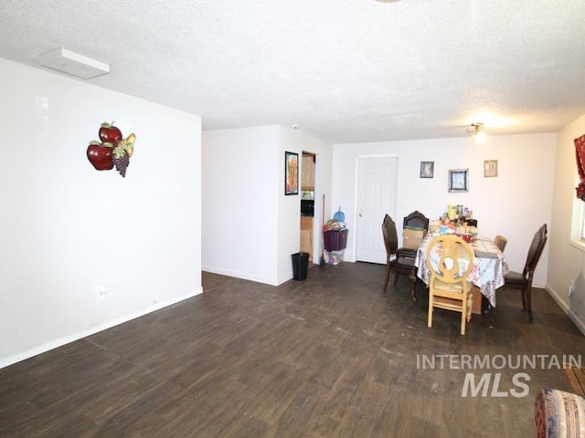 210 W 2nd St, Middleton, ID 83644 - dining area with wood finished floors, a textured ceiling, and baseboards