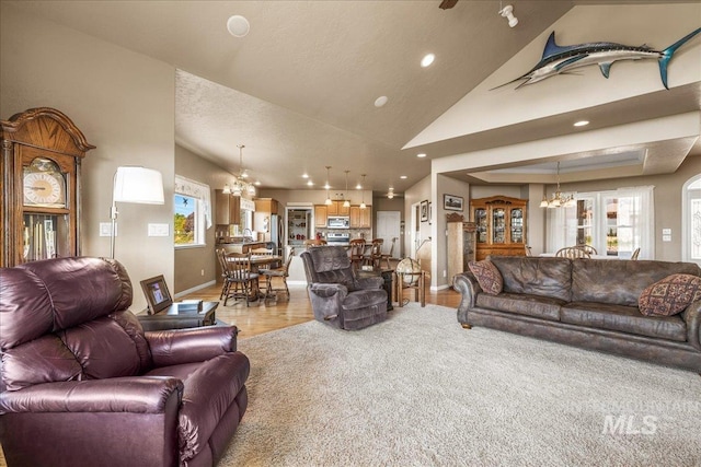 10395 Willis Rd, Middleton, ID 83644 - living area featuring lofted ceiling, recessed lighting, baseboards, a chandelier, and light wood-style floors