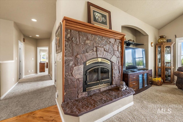 10395 Willis Rd, Middleton, ID 83644 - living area featuring vaulted ceiling, a fireplace, baseboards, and carpet floors