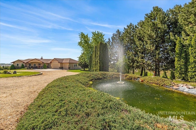 10395 Willis Rd, Middleton, ID 83644 - surrounding community with driveway and an attached garage