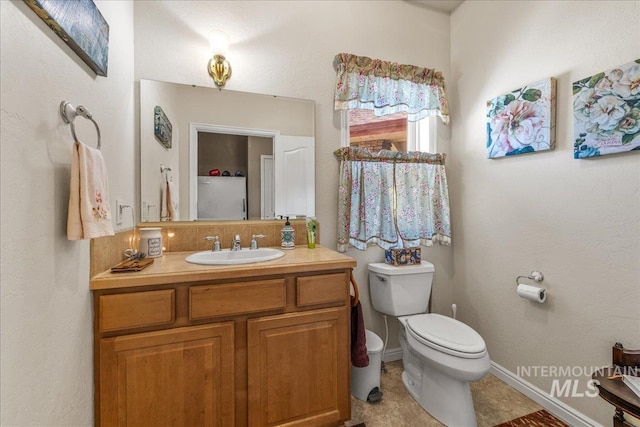 10395 Willis Rd, Middleton, ID 83644 - bathroom featuring vanity, toilet, baseboards, and tile patterned floors