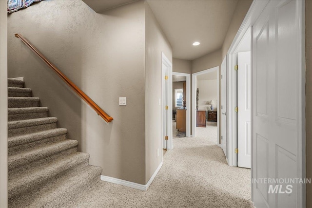 10395 Willis Rd, Middleton, ID 83644 - corridor with recessed lighting, stairway, baseboards, and carpet floors