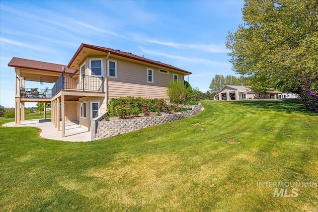 10395 Willis Rd, Middleton, ID 83644 - view of home's exterior with a yard, a patio, and a balcony