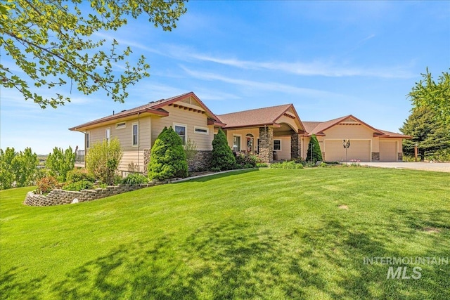 10395 Willis Rd, Middleton, ID 83644 - view of front of house featuring stone siding, an attached garage, driveway, and a front yard