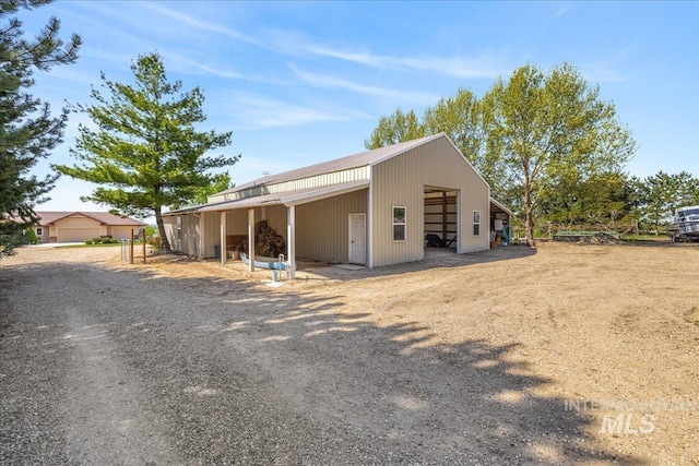 10395 Willis Rd, Middleton, ID 83644 - view of front facade featuring an outbuilding, an outdoor structure, and a detached garage