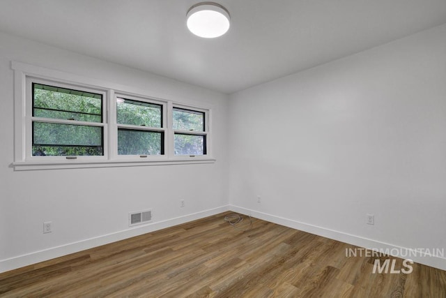 357 Pierce St, Twin Falls, ID 83301 - empty room featuring baseboards and wood finished floors