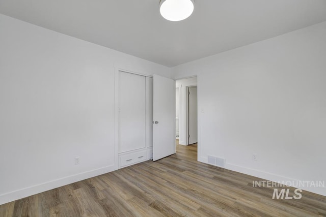 357 Pierce St, Twin Falls, ID 83301 - unfurnished room with baseboards and wood finished floors