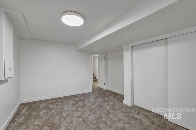 357 Pierce St, Twin Falls, ID 83301 - finished below grade area with carpet floors, baseboards, and stairway